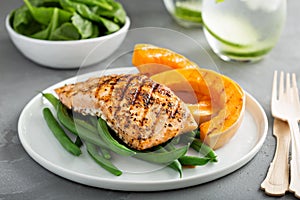 Grilled blackened salmon fillet with grilled squash photo