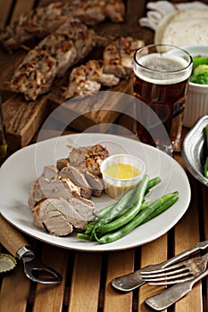 Grilled braided pork with green beans