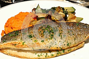 Grilled Branzino with basil, squash, and vegetables