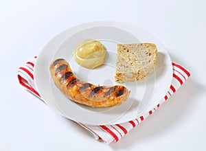 Grilled bratwurst with mustard