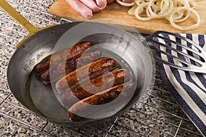 Grilled briitish sausages in a pan