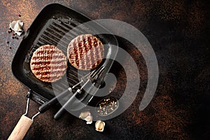 Grilled burger meat on grill pan