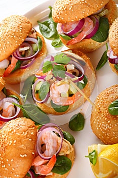 Grilled burgers with seafood on plate
