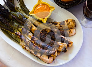 Grilled calcots with romesco sauce