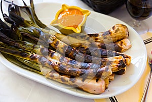 Grilled calcots with romesco sauce