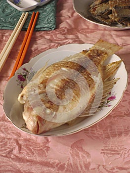 Grilled candlefish seafood dining