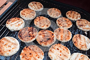 Grilled cheese arepas, made with cornmeal and cheese. Popular dish from Colombia