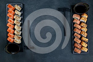 Grilled cheese and salmon maki rolls on plates