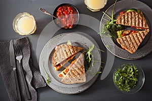 Grilled cheese sandwich with avocado and tomato photo