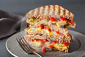 Grilled cheese sandwich with avocado and tomato photo