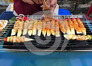 Grilled chicken bar-b-q or BBQ in street food market