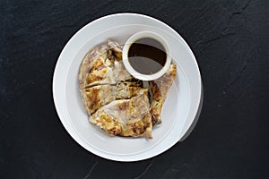 Grilled chicken on black tile