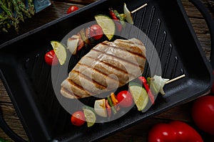 Grilled chicken breast with brochette vegetable