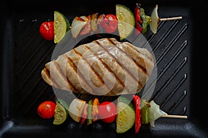 Grilled chicken breast with brochette vegetable