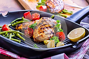 Grilled chicken breast in different variations with cherry tomat