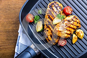 Grilled chicken breast in different variations with cherry tomat