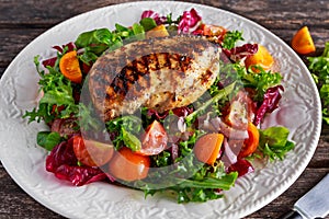 Grilled Chicken Breast fillet with fresh tomatoes vegetables salad. concept healthy food.