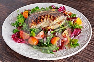 Grilled Chicken Breast fillet with fresh tomatoes vegetables salad. concept healthy food.