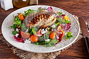 Grilled Chicken Breast fillet with fresh tomatoes vegetables salad. concept healthy food.