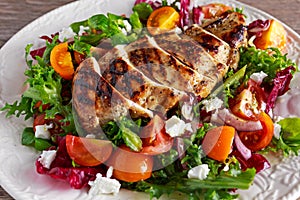 Grilled Chicken Breast fillet with fresh tomatoes vegetables salad. concept healthy food.