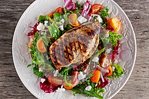 Grilled Chicken Breast fillet with fresh tomatoes vegetables salad. concept healthy food.