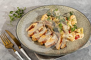 Grilled chicken breast sliced with stewed cauliflower and white sauce
