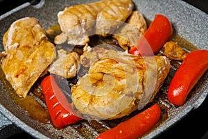 Grilled chicken breast slices with bell pepper