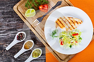 Grilled chicken breast and spring cabbage salad, top view