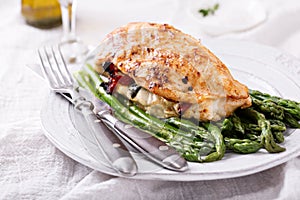 Grilled chicken breast stuffed with mozzarella