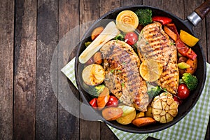 Grilled chicken breast and vegetables photo