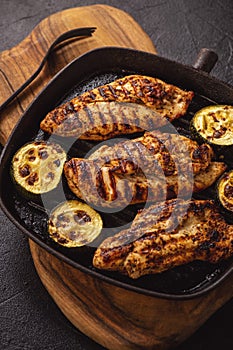 Grilled chicken breasts and zucchini