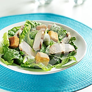 Grilled chicken on caesar salad