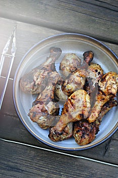 Grilled chicken drums with mushrooms. BBQ background. Summer barbeque