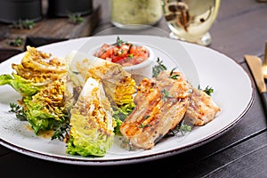 Grilled chicken fillet with mini romen and tomatoes salsa