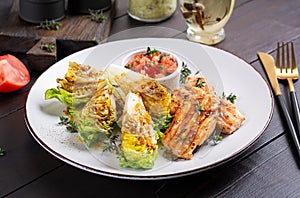 Grilled chicken fillet with mini romen and tomatoes salsa photo
