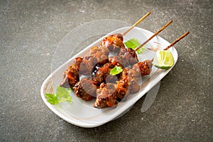 Grilled chicken gizzard skewer with herbs and spices