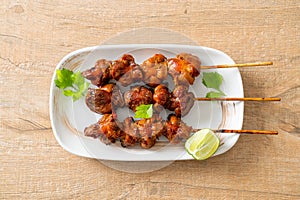 Grilled chicken gizzard skewer with herbs and spices