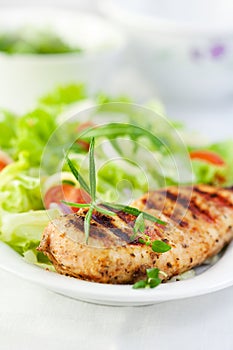 Grilled chicken with herbs and salad