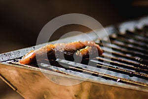 Grilled chicken on a hot stove