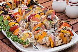 Grilled chicken kabobs on a platter