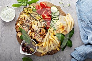 Grilled chicken kebabs platter with vegetables