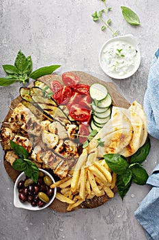 Grilled chicken kebabs platter with vegetables
