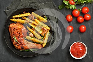 Grilled chicken leg with herbs and fried potatoes