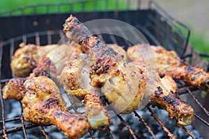 Grilled chicken legs, drumstick. charcoal meat closeupnn