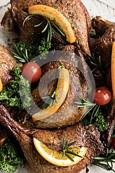 Grilled chicken legs and vegetables on the grill pan macro. horizontal view from above