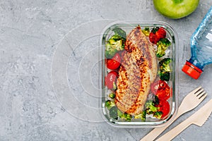 Grilled chicken meal prep containers with rice, broccoli and tomatoes