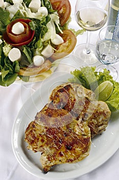 Grilled chicken meat served in Brazil gastronomy photo