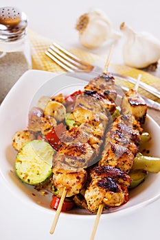 Grilled chicken meat on skewer photo