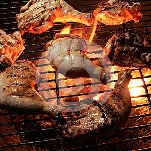 Grilled chicken on an open flame