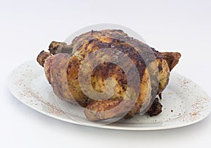 Grilled Chicken (pollo a la brasa) on white plate. photo
